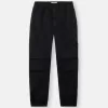 Losvallende joggingbroek met drukknopen en zakken met ritssluiting Losvallende joggingbroek met drukknopen en zakken met ritssluiting