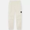 Losvallende joggingbroek met drukknopen en zakken met ritssluiting Losvallende joggingbroek met drukknopen en zakken met ritssluiting