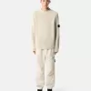 Losvallende joggingbroek met drukknopen en zakken met ritssluiting Losvallende joggingbroek met drukknopen en zakken met ritssluiting