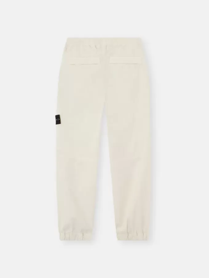 Losvallende joggingbroek met drukknopen en zakken met ritssluiting Losvallende joggingbroek met drukknopen en zakken met ritssluiting