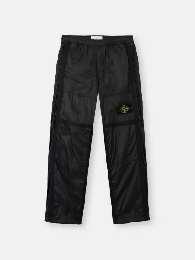 Ruime joggingbroek met ritszakken en verstelbare boorden Ruime joggingbroek met ritszakken en verstelbare boorden
